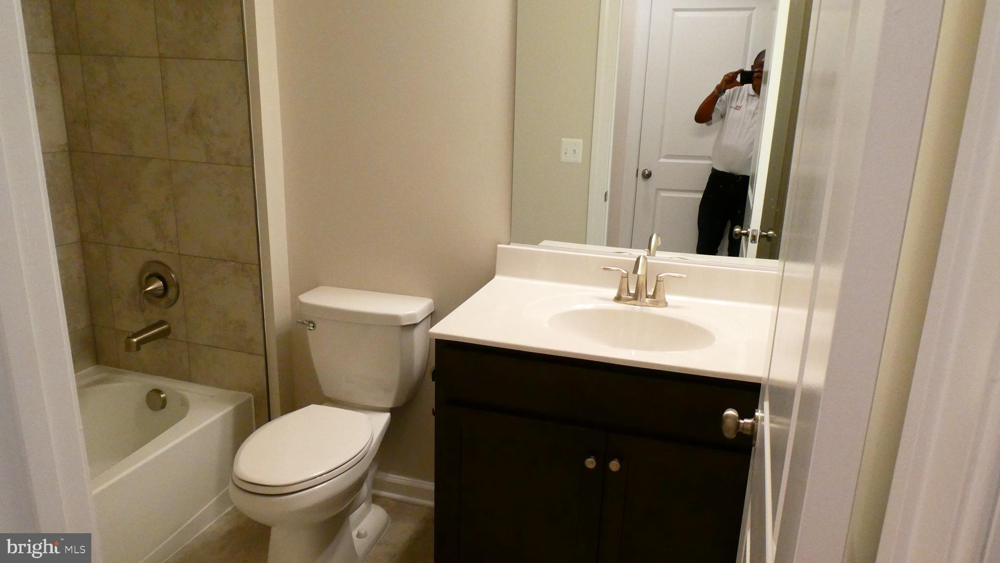 2329 Stephanie Tessa Lane Woodbridge, VA 22191 - Photo 17 of 50 a bathroom with a sink toilet and shower