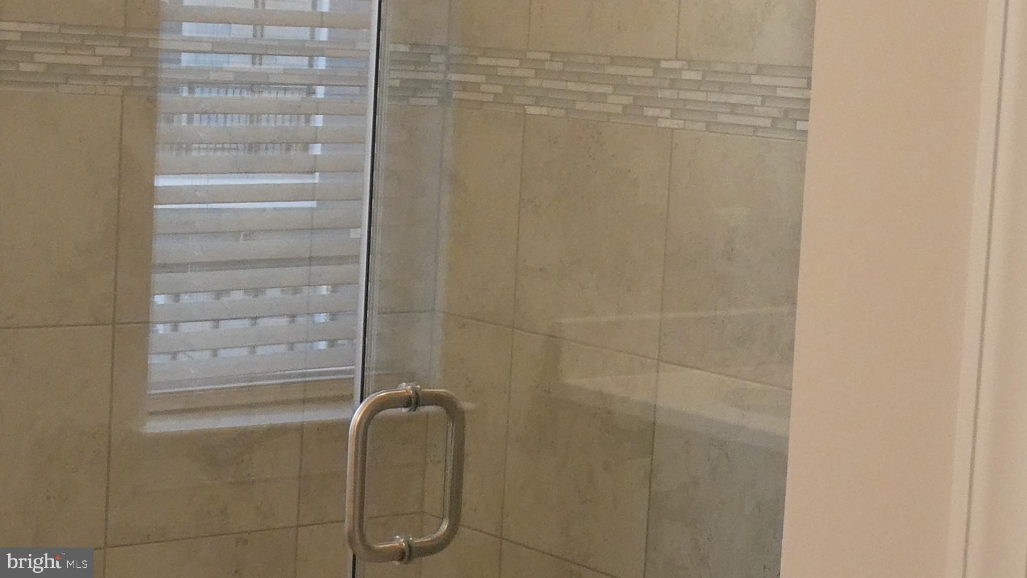 2329 Stephanie Tessa Lane Woodbridge, VA 22191 - Photo 27 of 50 a bathroom with a glass door shower