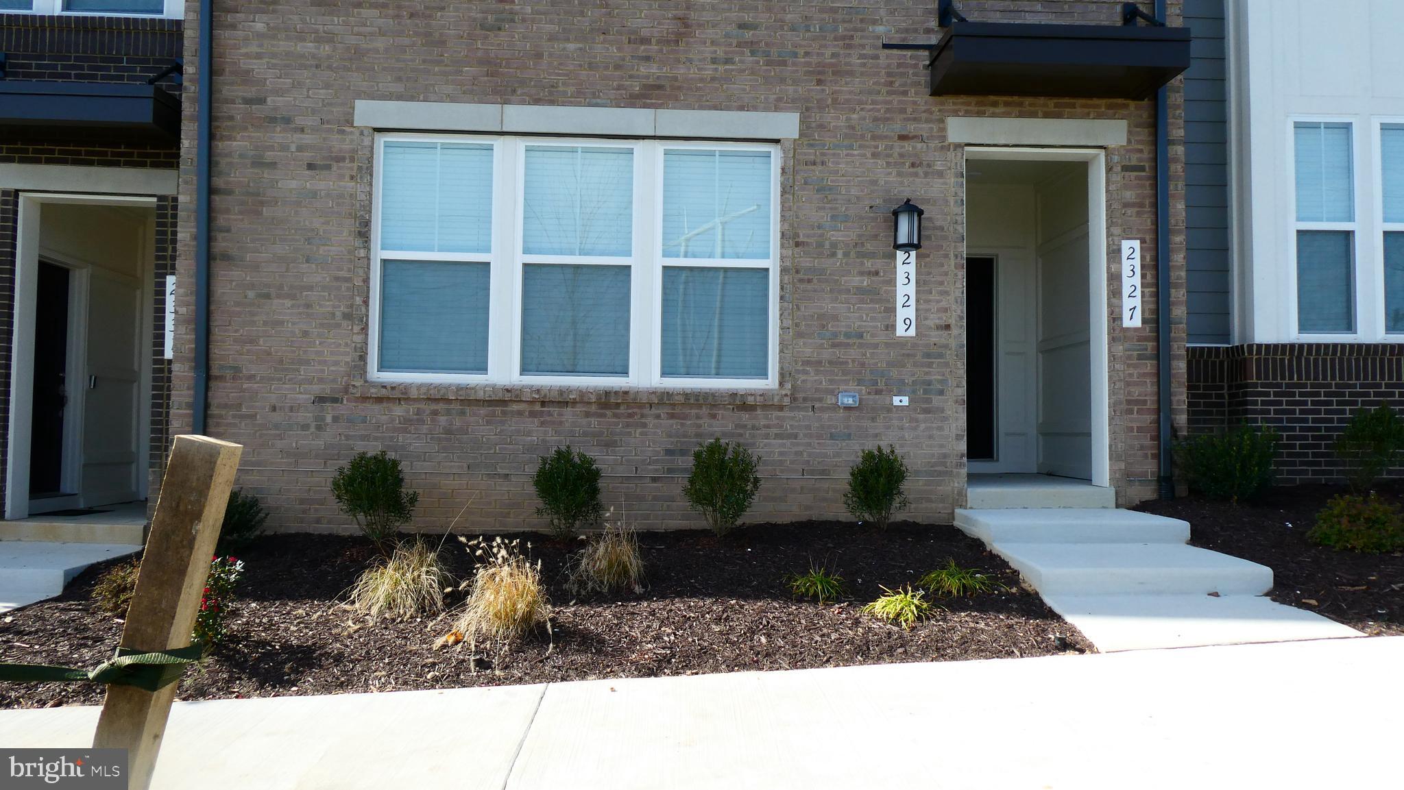 2329 Stephanie Tessa Lane Woodbridge, VA 22191 - Photo 3 of 50 a front view of a house with patio