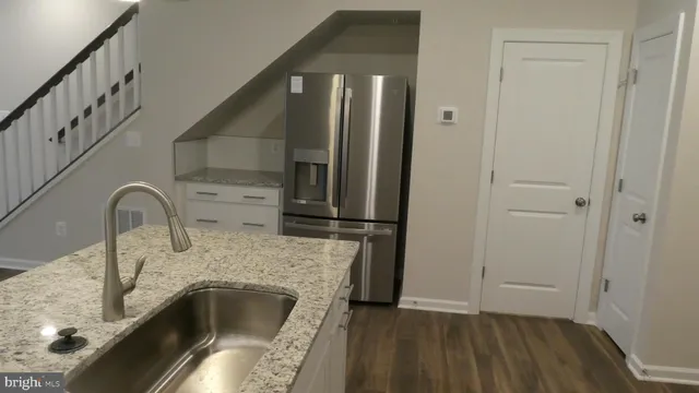 a bathroom with a sink and mirror