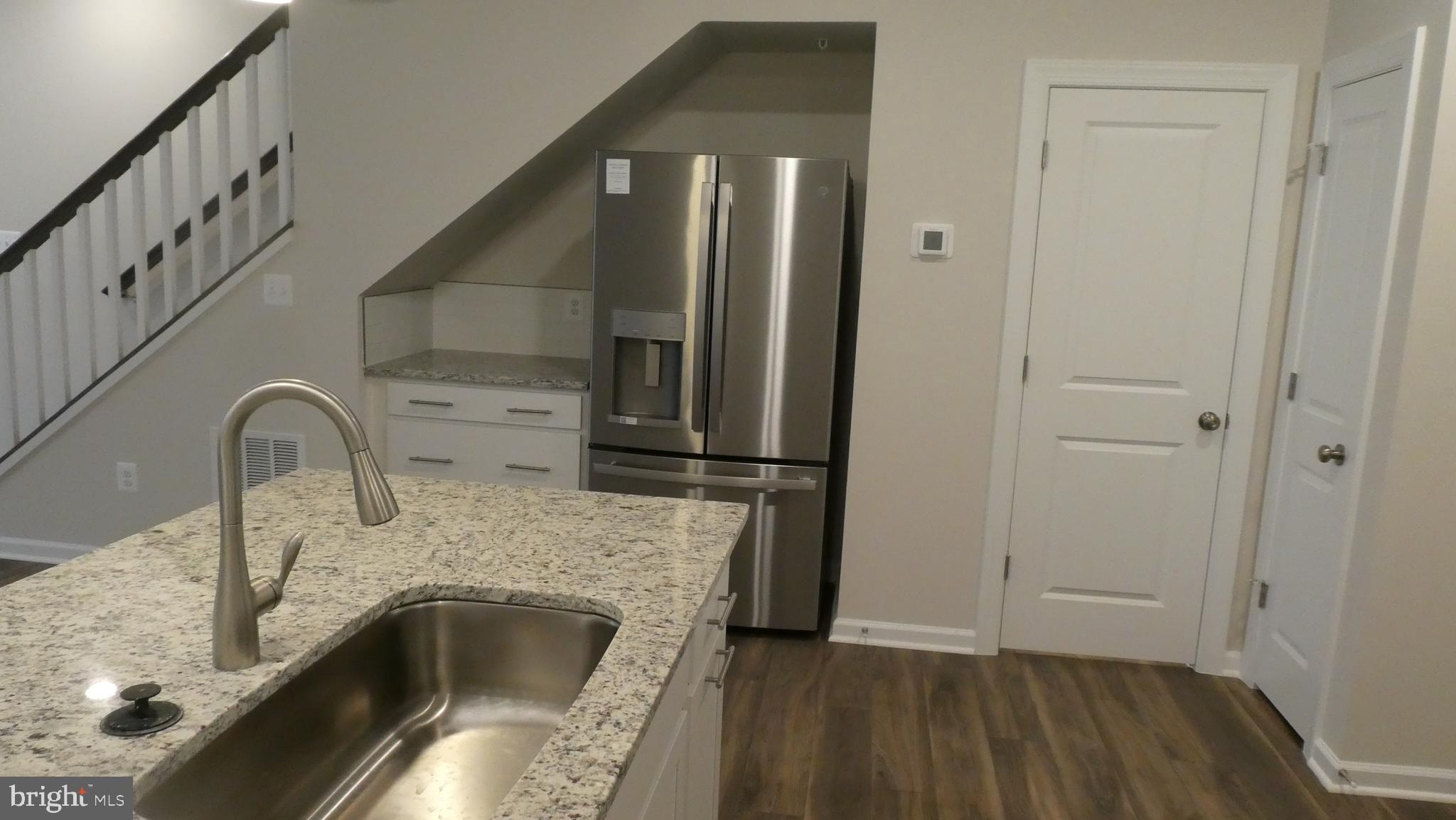 2329 Stephanie Tessa Lane Woodbridge, VA 22191 - Photo 39 of 50 a kitchen with a sink and a refrigerator