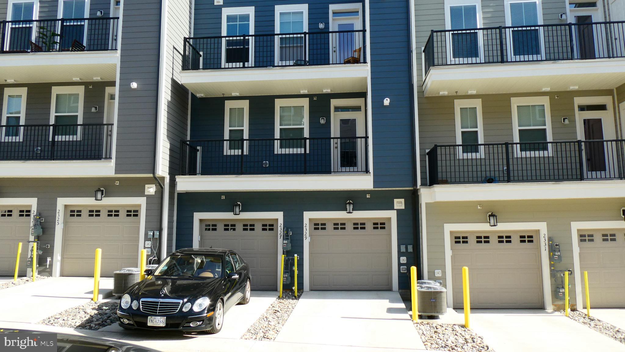 2329 Stephanie Tessa Lane Woodbridge, VA 22191 - Photo 46 of 50 a view of a building with a outdoor space
