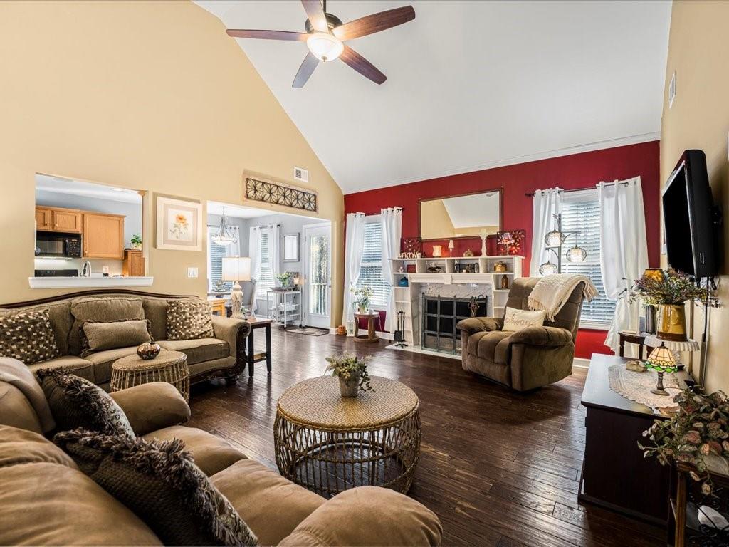76 Kessle Lane Dallas, GA 30132 - Photo 14 of 33 a living room with furniture fireplace and a large window