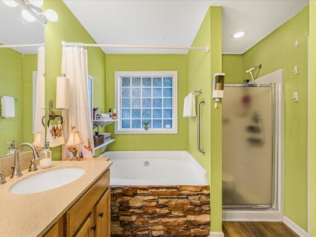 76 Kessle Lane Dallas, GA 30132 - Photo 20 of 33 a bathroom with a granite countertop sink a mirror and a shower