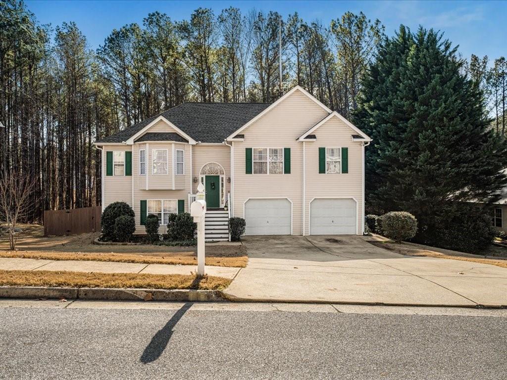 76 Kessle Lane Dallas, GA 30132 - Photo 2 of 33 a front view of a house with a yard