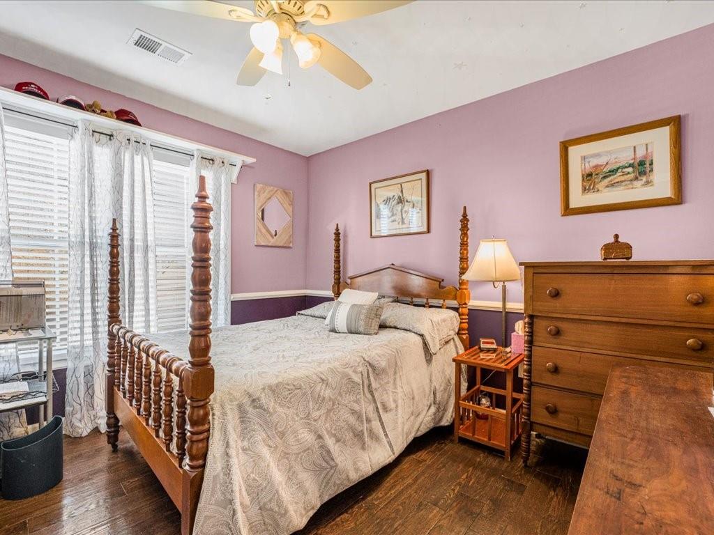 76 Kessle Lane Dallas, GA 30132 - Photo 22 of 33 a bedroom with a bed and a chandelier