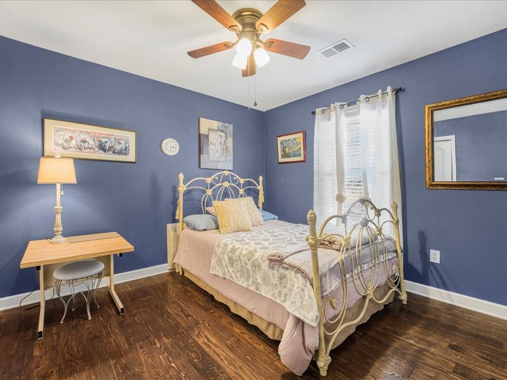76 Kessle Lane Dallas, GA 30132 - Photo 23 of 33 a bedroom with a bed and a table in it