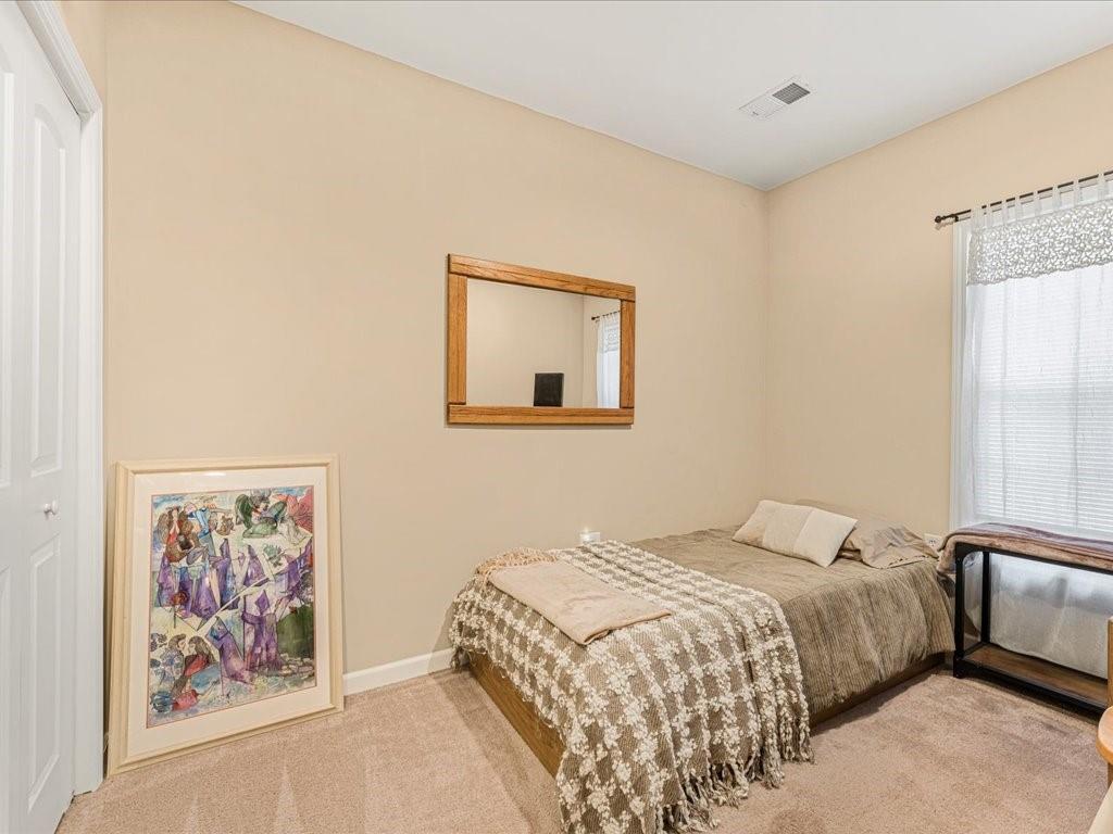 76 Kessle Lane Dallas, GA 30132 - Photo 27 of 33 a bedroom with a bed and painting on the wall
