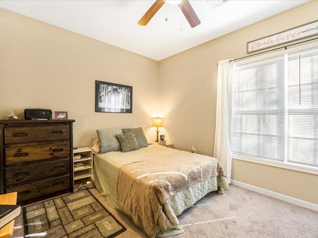 76 Kessle Lane Dallas, GA 30132 - Photo 28 of 33 a bedroom with a bed and a window