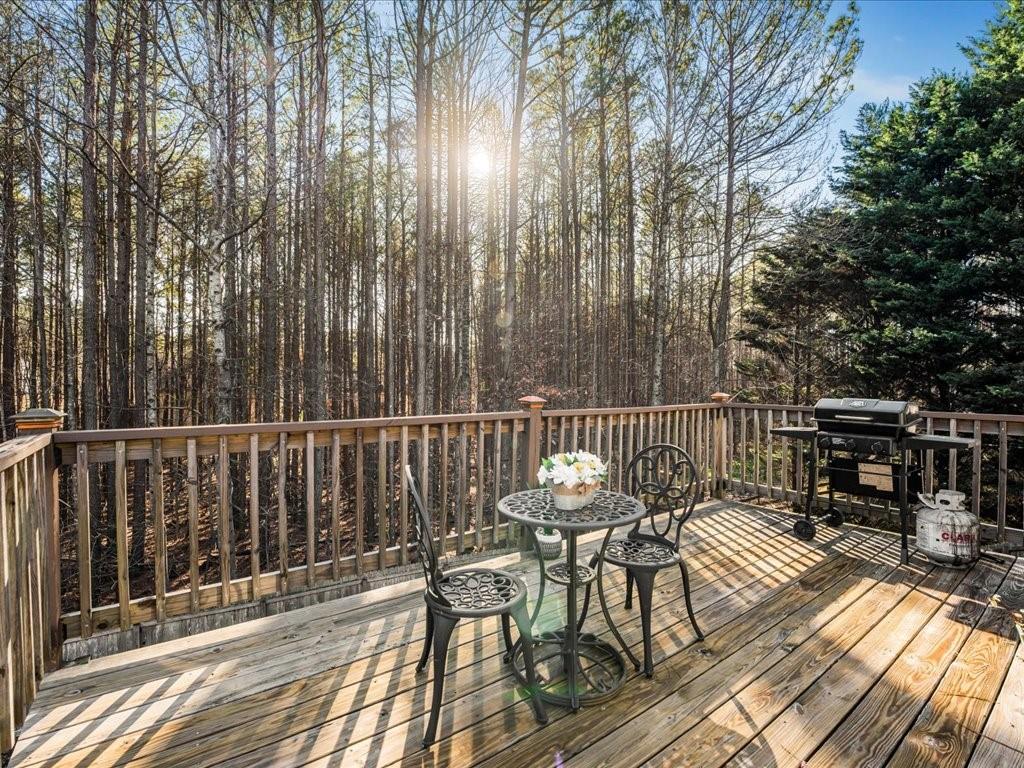 76 Kessle Lane Dallas, GA 30132 - Photo 30 of 33 a view of balcony with wooden floor outdoor seating and yard in the back