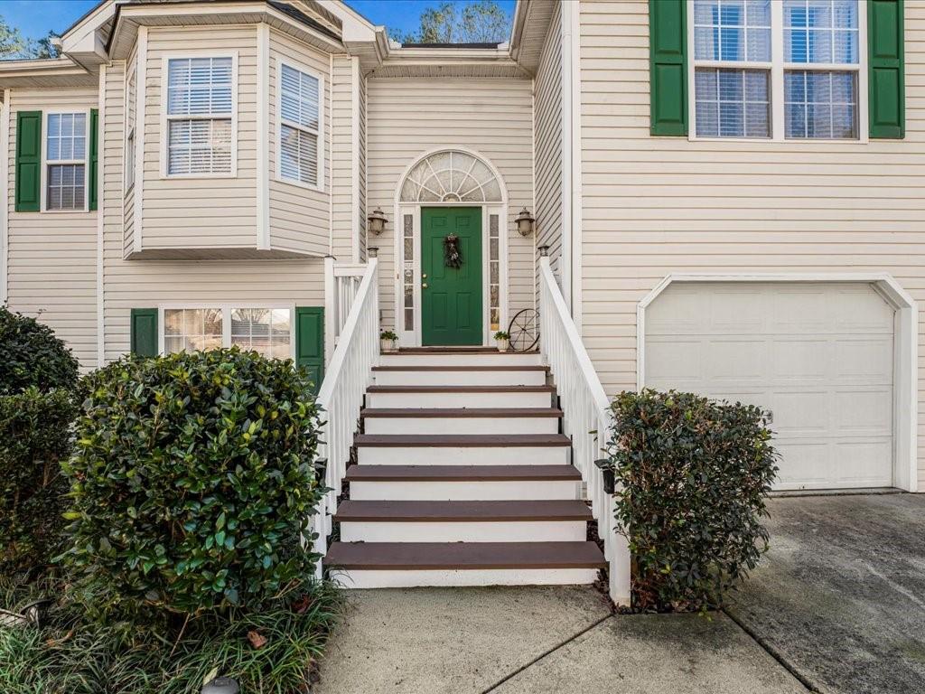 76 Kessle Lane Dallas, GA 30132 - Photo 4 of 33 a front view of a house with a garden