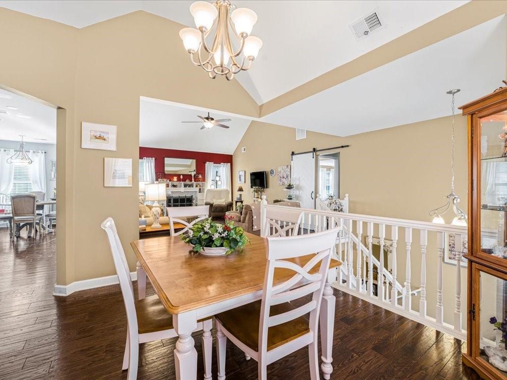 76 Kessle Lane Dallas, GA 30132 - Photo 7 of 33 a view of a dining room with furniture wooden floor and chandelier
