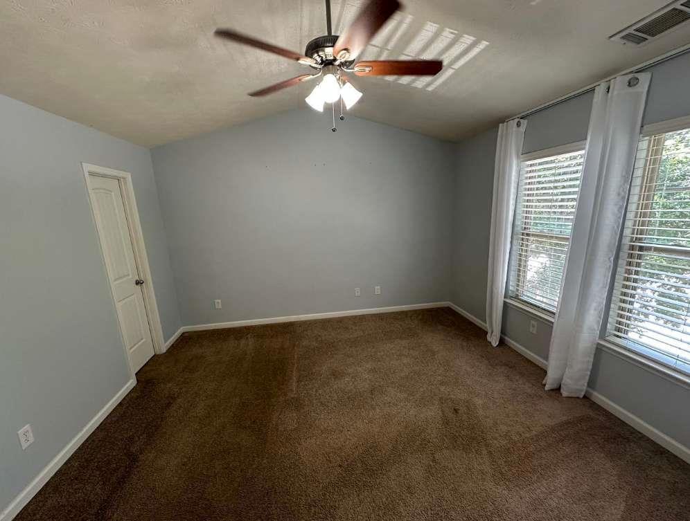 5103 Jack Drive Decatur, GA 30035 - Photo 12 of 34 an empty room with windows and fan