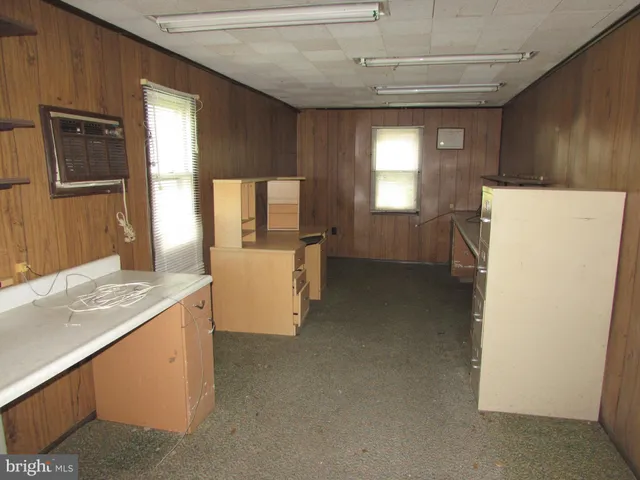 a kitchen with a refrigerator a stove and a sink