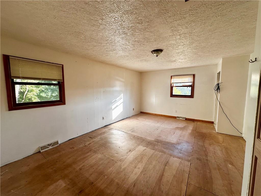 4 Wabash Avenue Hickory, PA 15340 - Photo 13 of 19 a view of an empty room with wooden floor and a window