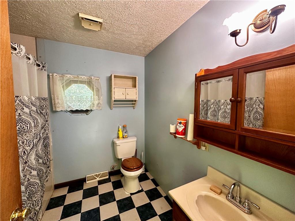 4 Wabash Avenue Hickory, PA 15340 - Photo 14 of 19 a bathroom with a sink and a mirror