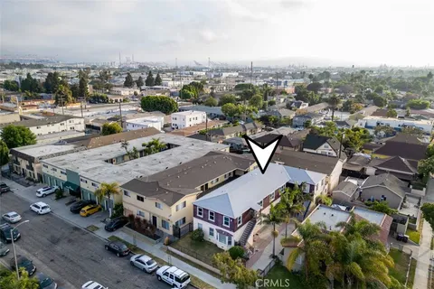 an aerial view of a house with outdoor space