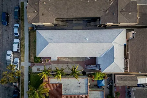 an aerial view of a building with street
