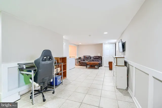 a view of a livingroom with furniture and a flat screen tv
