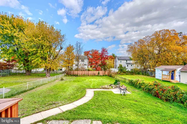 a view of a chairs and table in the balcony