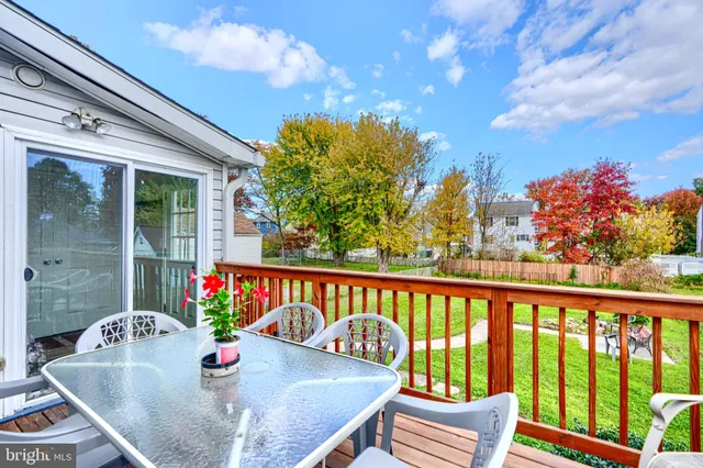 a sitting area with swimming pool and green space