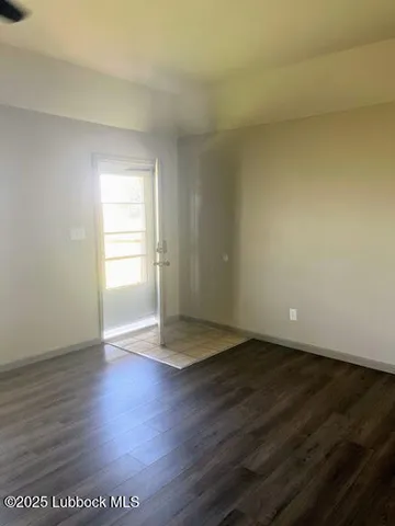 a view of an empty room and window