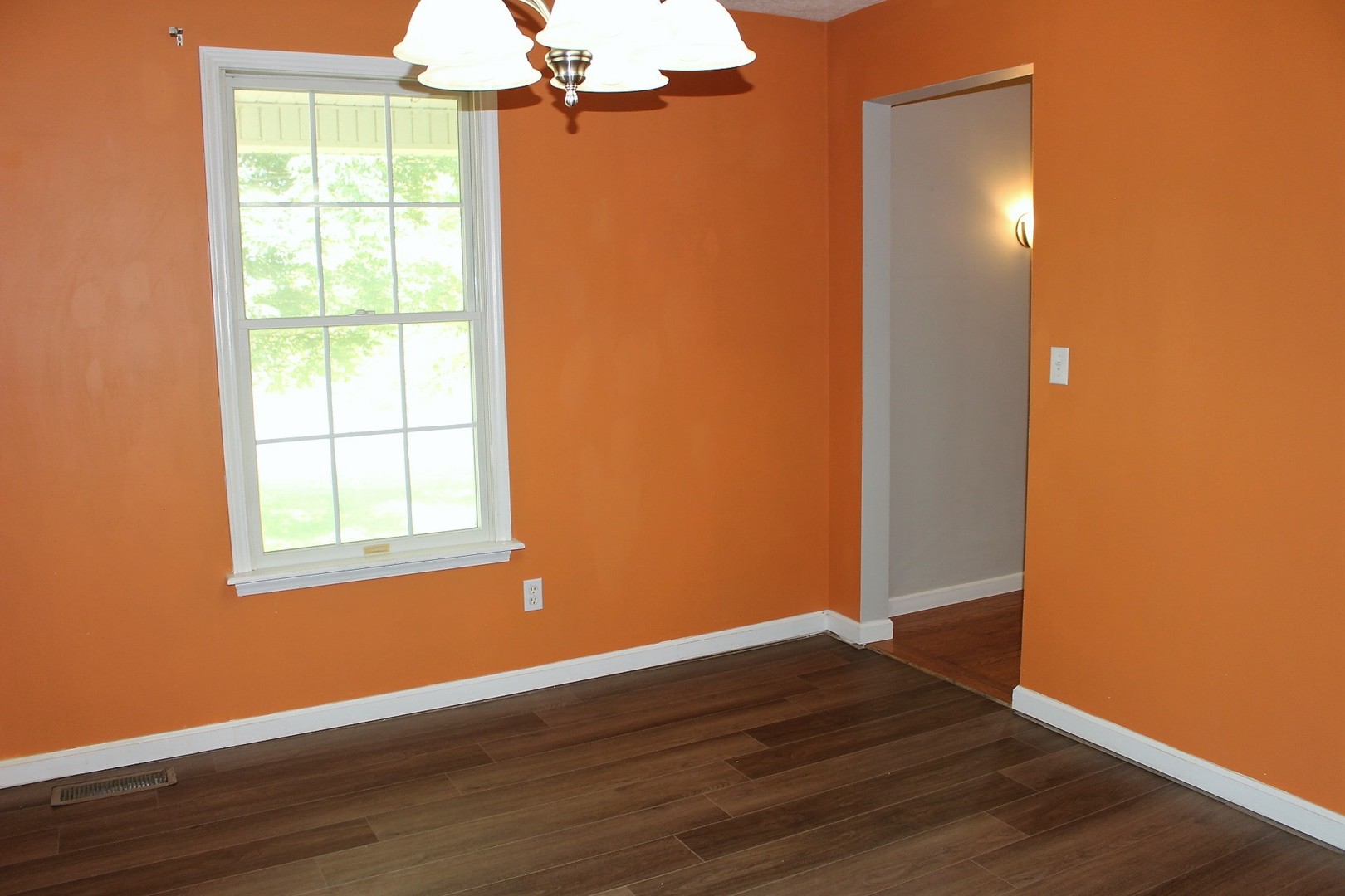 13382 Hickory Grove Road Waynesville, IL 61778 - Photo 19 of 51 an empty room with wooden floor closet and windows