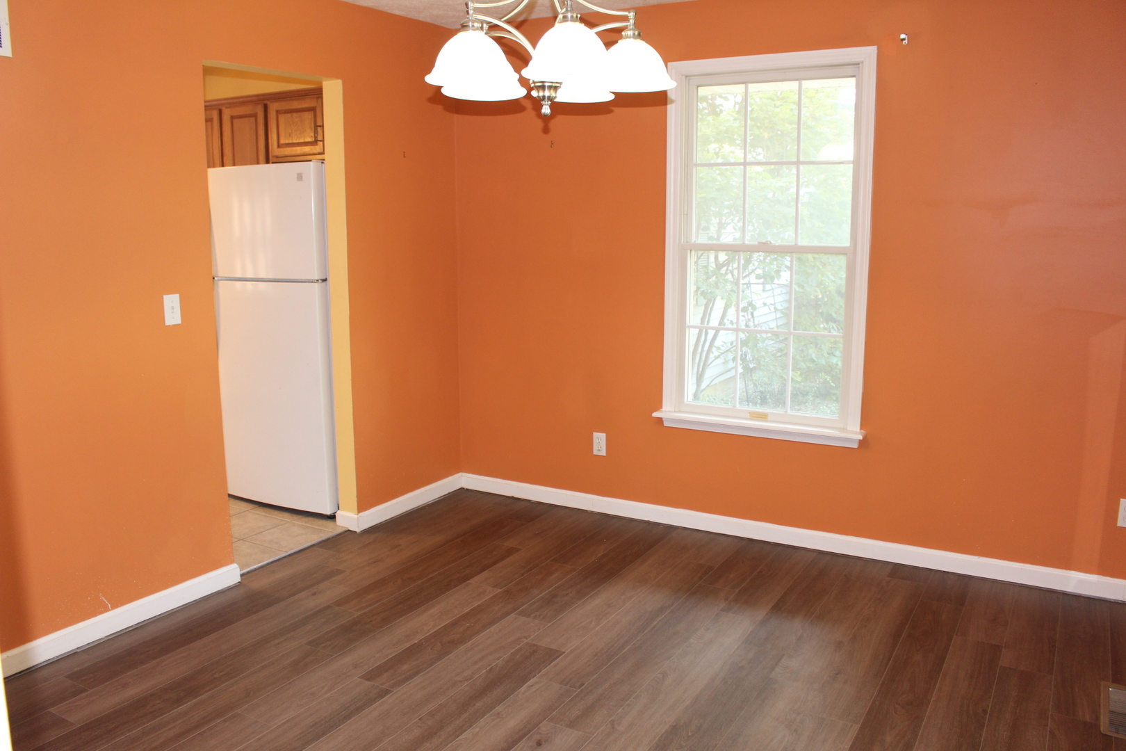13382 Hickory Grove Road Waynesville, IL 61778 - Photo 20 of 51 an empty room with wooden floor and windows