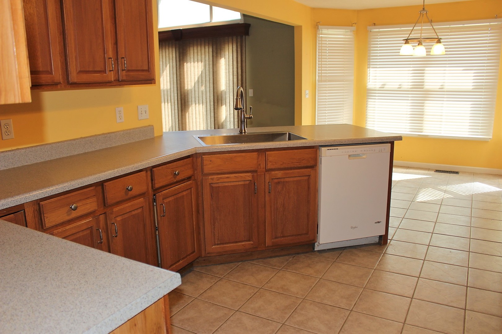13382 Hickory Grove Road Waynesville, IL 61778 - Photo 21 of 51 a kitchen with stainless steel appliances a sink window and cabinets