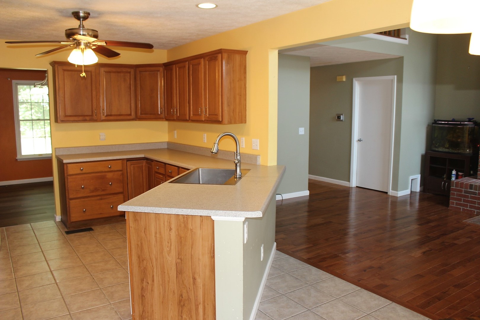 13382 Hickory Grove Road Waynesville, IL 61778 - Photo 22 of 51 a kitchen with a sink a stove and cabinets