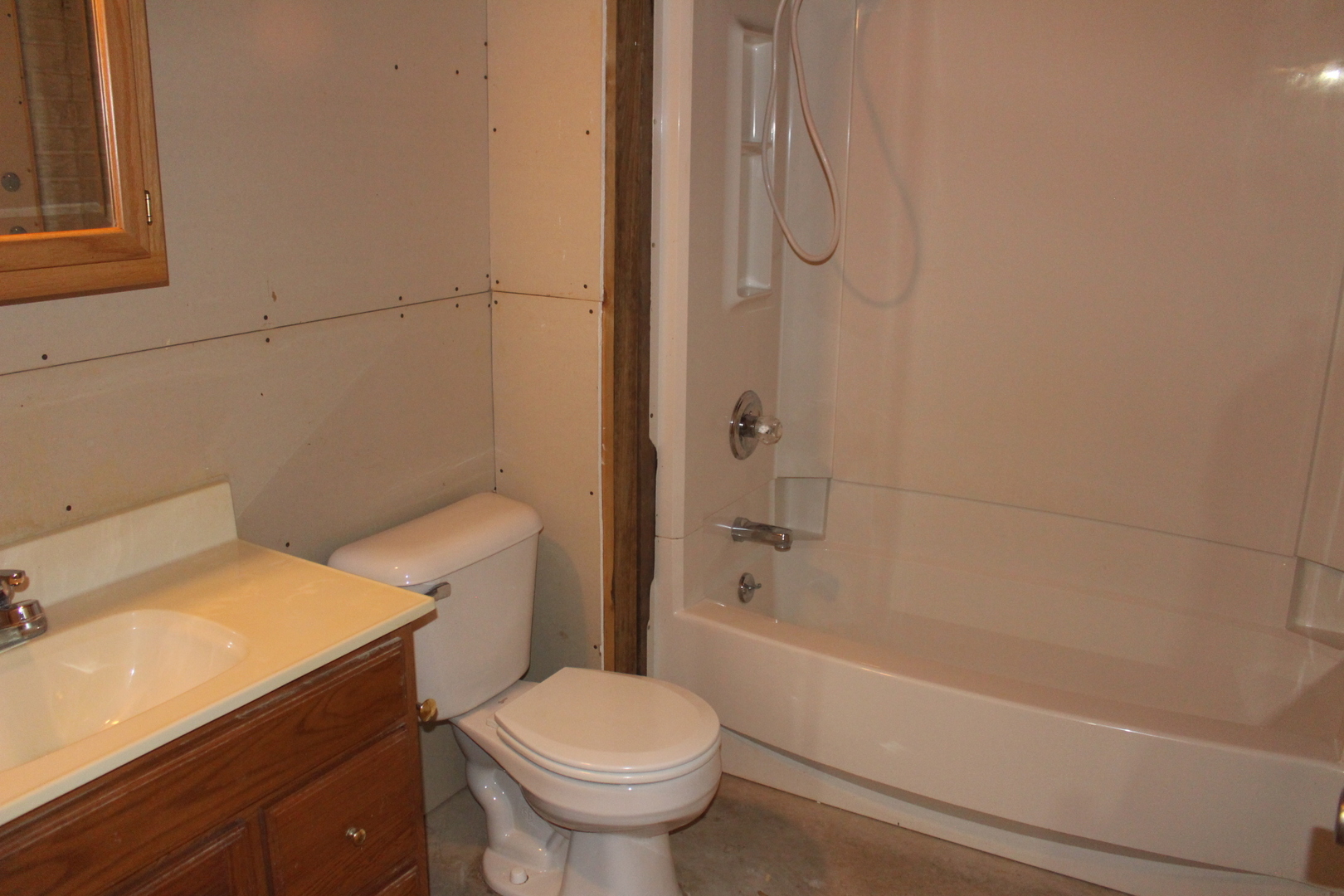 13382 Hickory Grove Road Waynesville, IL 61778 - Photo 40 of 51 a bathroom with a sink a toilet and shower