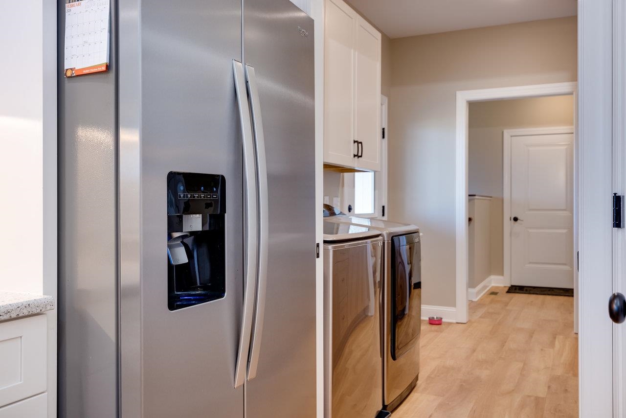 1776 Old Providence Road Raphine, VA 24472 - Photo 18 of 73 a view of a kitchen with refrigerator and wooden floor
