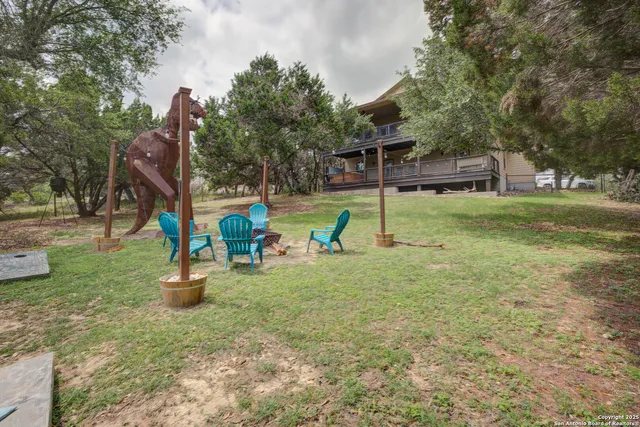 a view of outdoor space with playground and green space