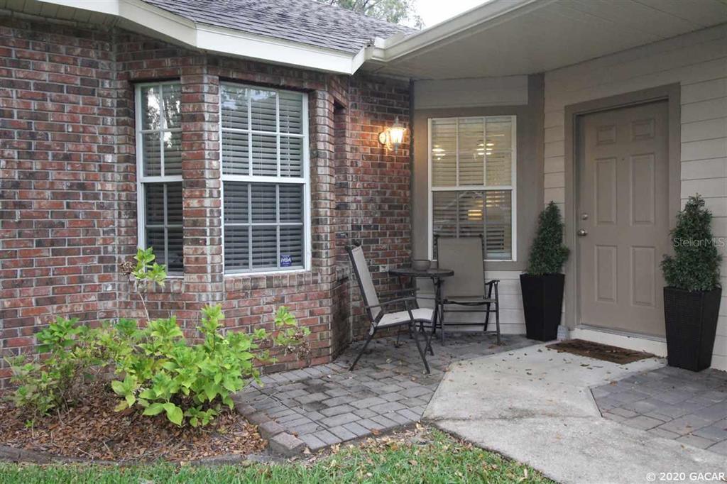 4746 Northwest 75th Road Gainesville, FL 32653 - Photo 1 of 1 a view of a house with backyard and sitting area