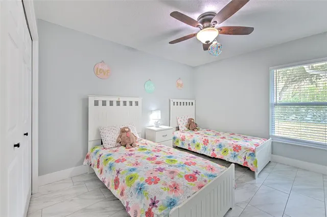 a dining room with furniture a chandelier and wooden floor