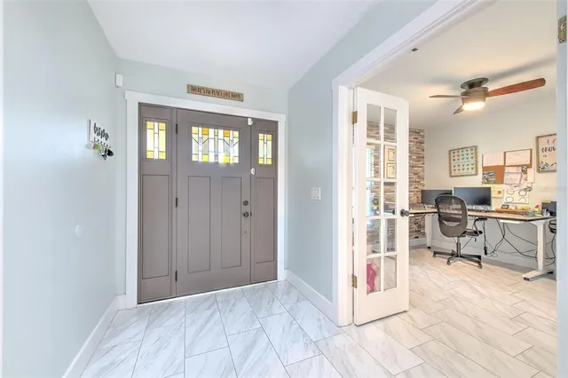 a playing room with furniture and a window