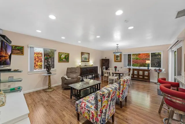 a view of a workspace with furniture and book shelf