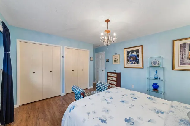 an aerial view of residential houses with outdoor space and street view