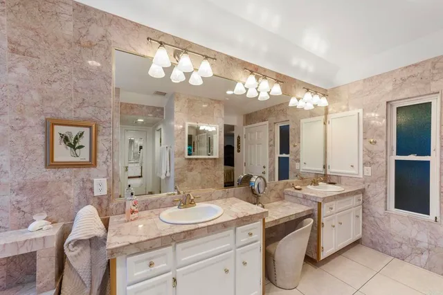 a front view of a house with outdoor seating