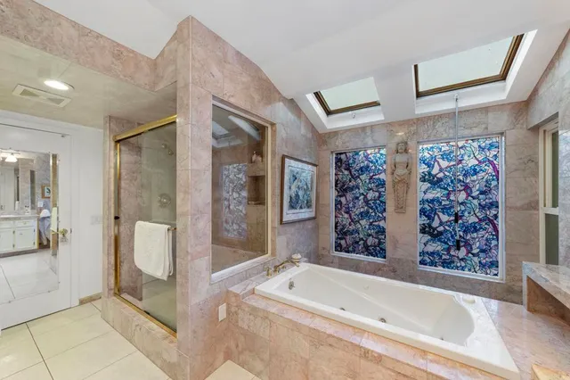 a view of a patio with chairs and plants