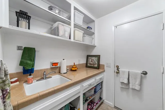 a view of a chairs and table in a backyard