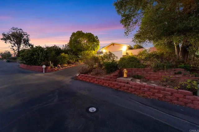 a bedroom with furniture and a large window