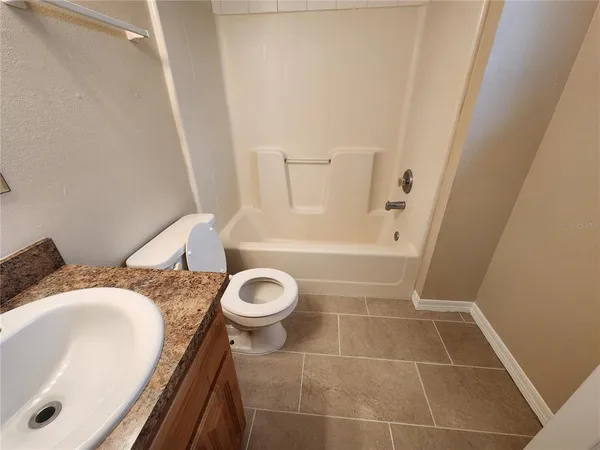 a bathroom with a sink and toilet