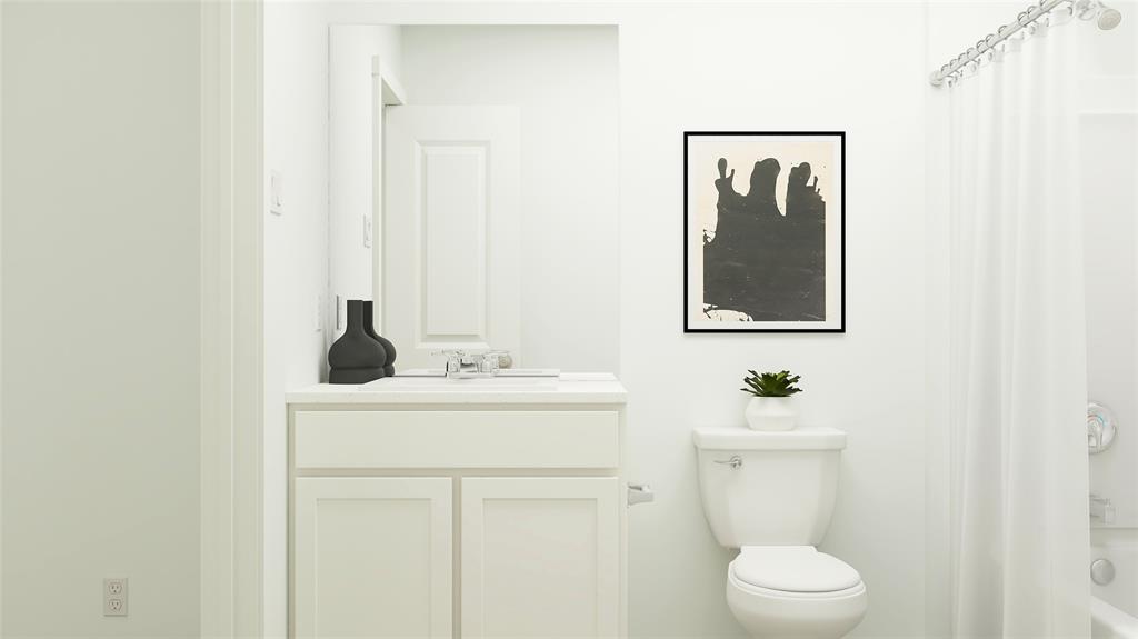 241 Boxberry Way Princeton, TX 75407 - Photo 18 of 21 a bathroom with a toilet sink and mirror