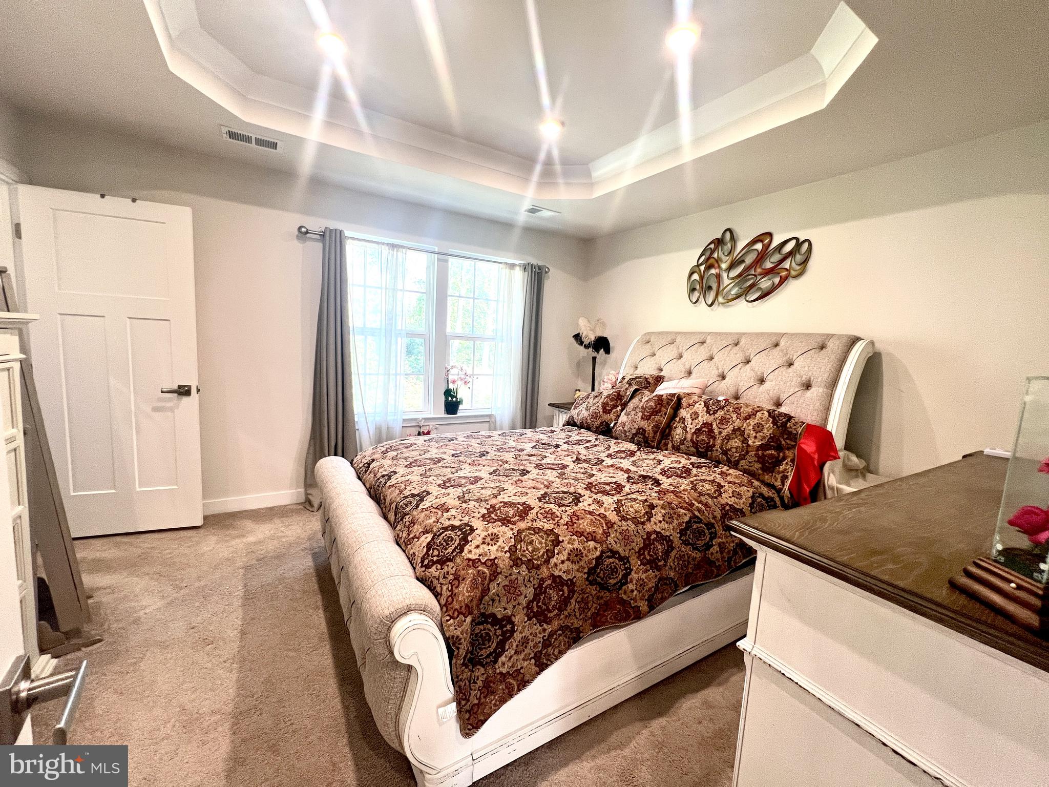 2060 Rivers Drive Newark, DE 19702 - Photo 17 of 25 a bed sitting in a bedroom next to a window