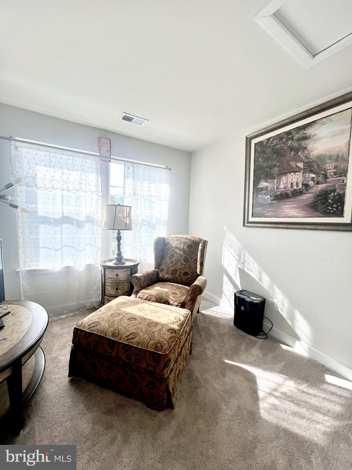2060 Rivers Drive Newark, DE 19702 - Photo 21 of 25 a spacious bedroom with a bed a couch and a window