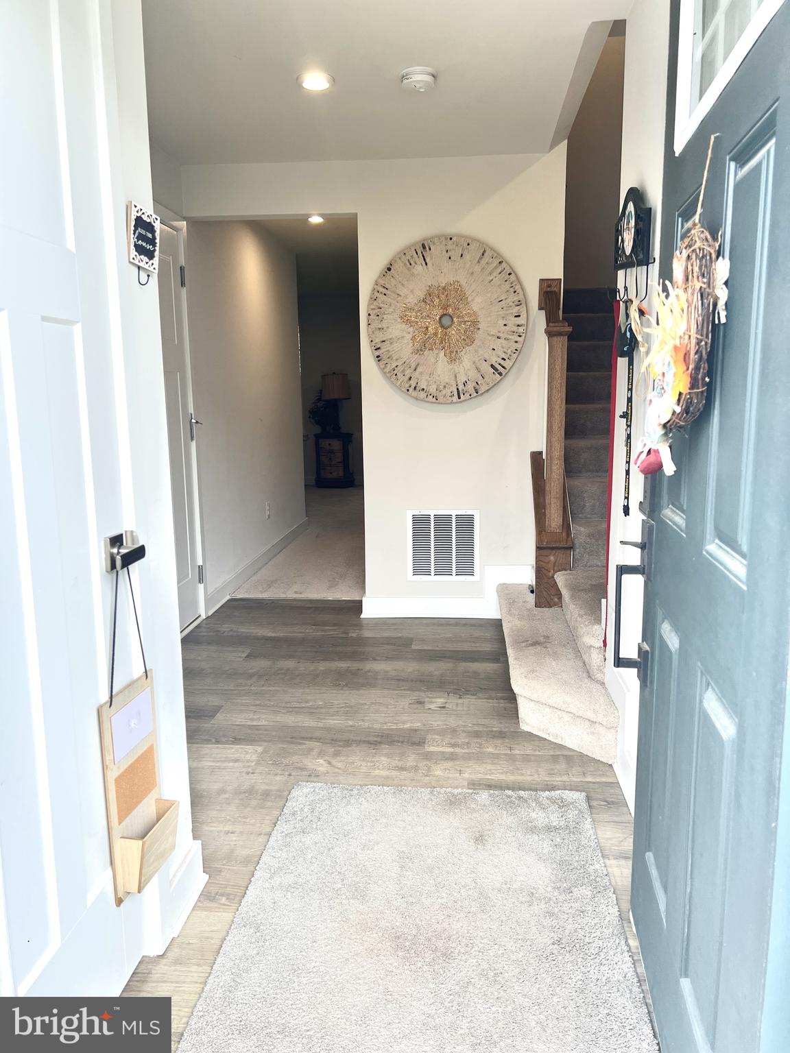 2060 Rivers Drive Newark, DE 19702 - Photo 5 of 25 a view of a hallway with a dining table and chairs