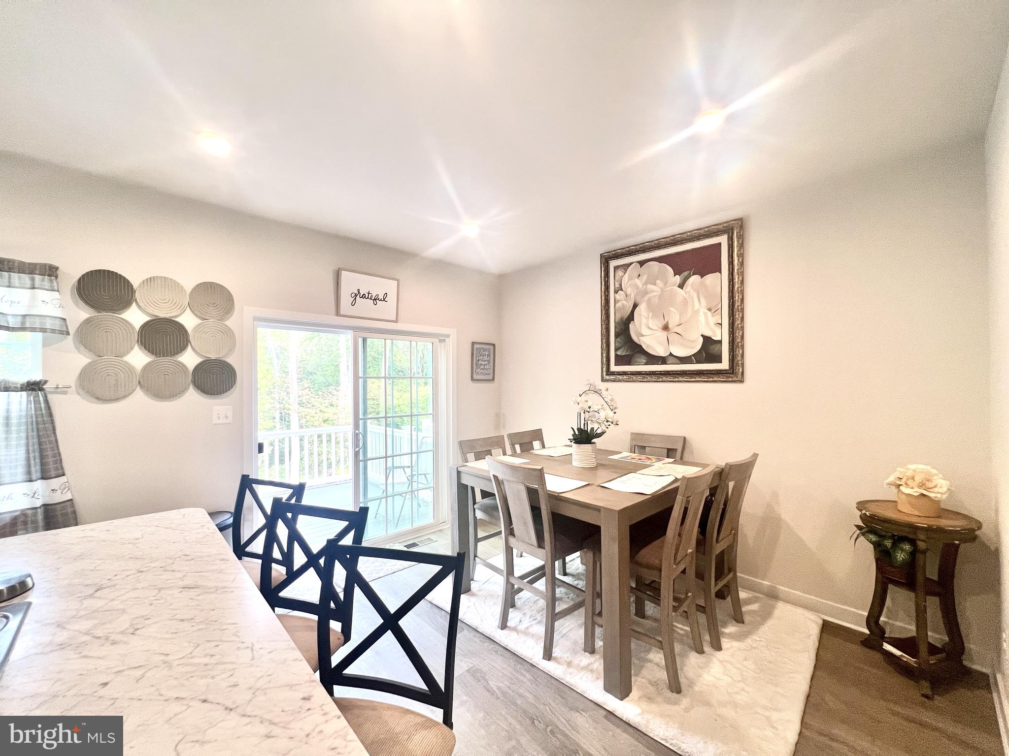 2060 Rivers Drive Newark, DE 19702 - Photo 10 of 25 a view of a dining room with furniture and wooden floor