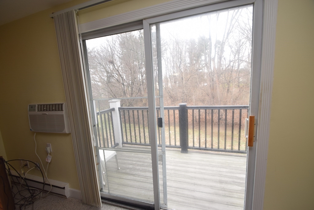 13 Walker Road, Unit 12 North Andover, MA 01845 - Photo 5 of 18 a view of a balcony with wooden floor