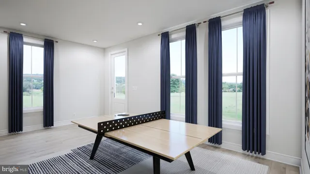 a view of a room with furniture and window